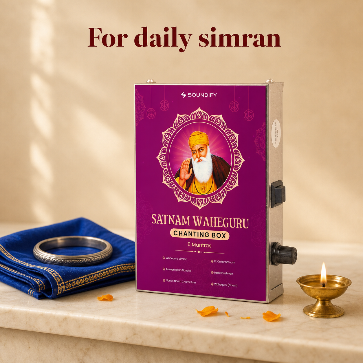 Waheguru Sikh mantra box on a marble shelf with rumala, kara and lit jot - for daily simran